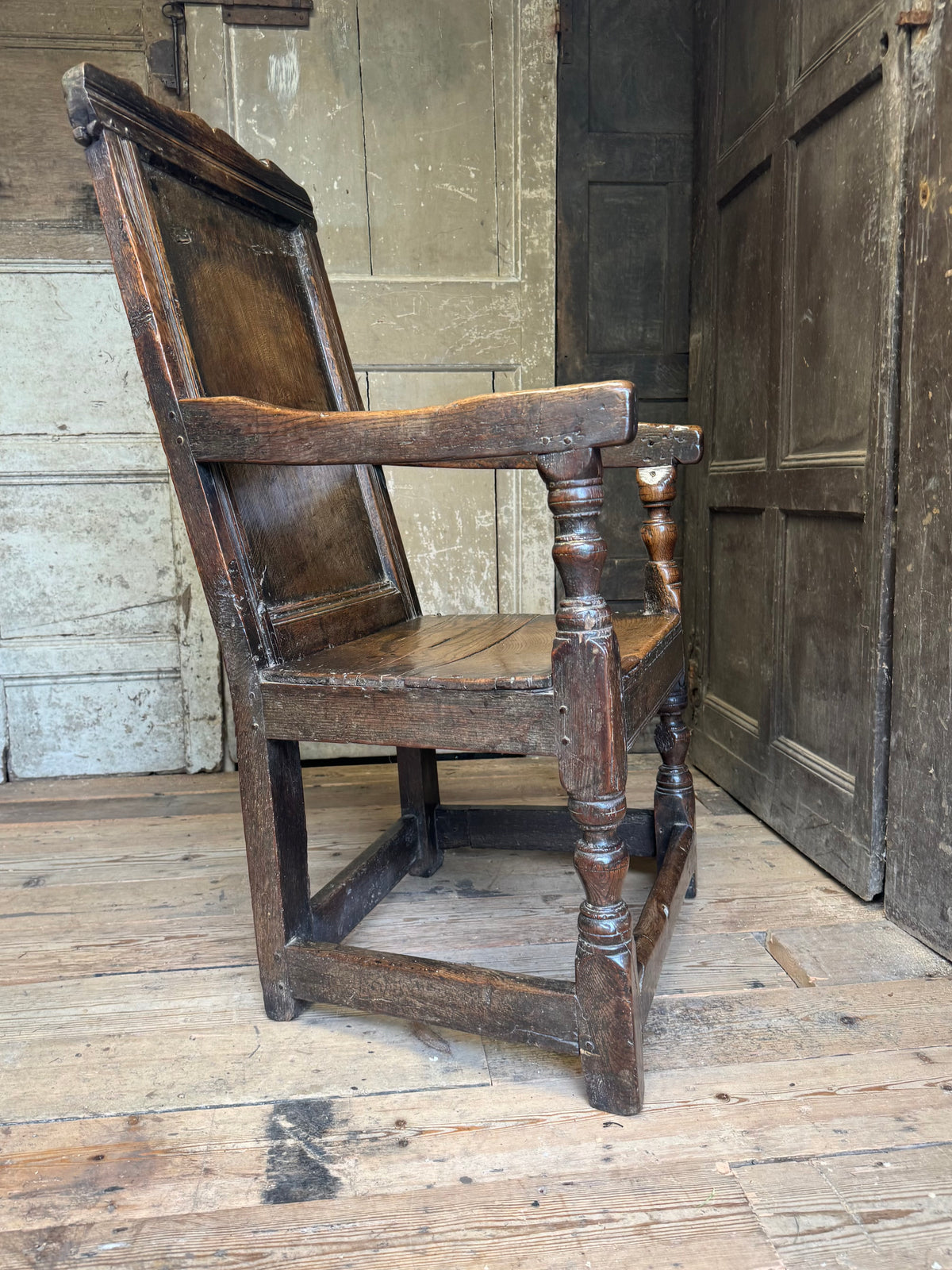 A North country 17th century oak wainscot armchair of excellent colour