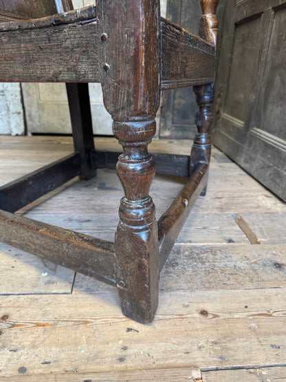 A North country 17th century oak wainscot armchair of excellent colour