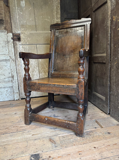 A North country 17th century oak wainscot armchair of excellent colour