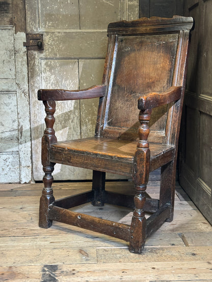 A North country 17th century oak wainscot armchair of excellent colour