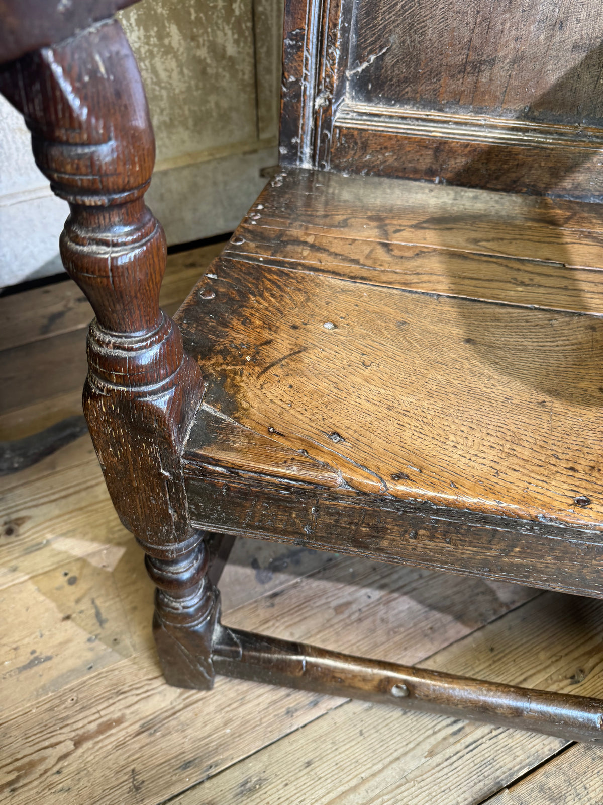 A North country 17th century oak wainscot armchair of excellent colour