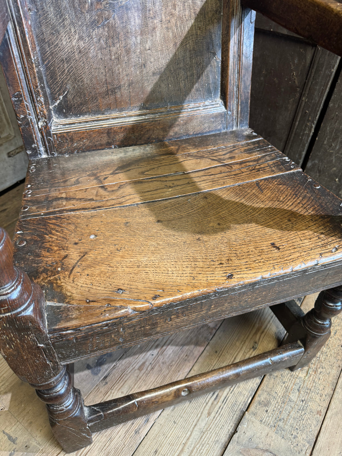 A North country 17th century oak wainscot armchair of excellent colour