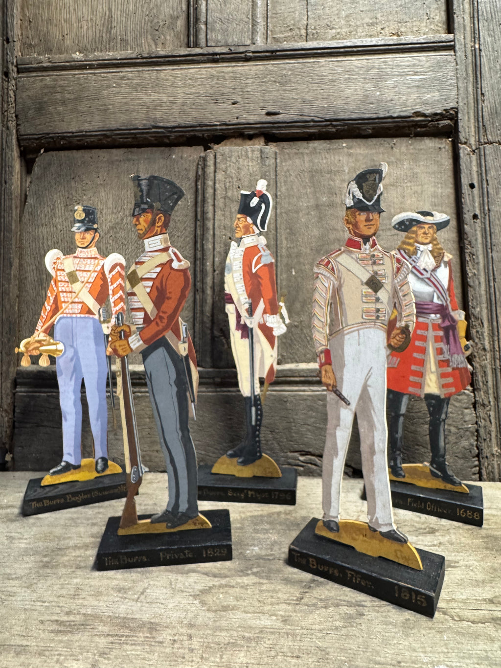 A  group of five  wooden painted soldiers The Buffs by Lt E.V Howell c. 1929