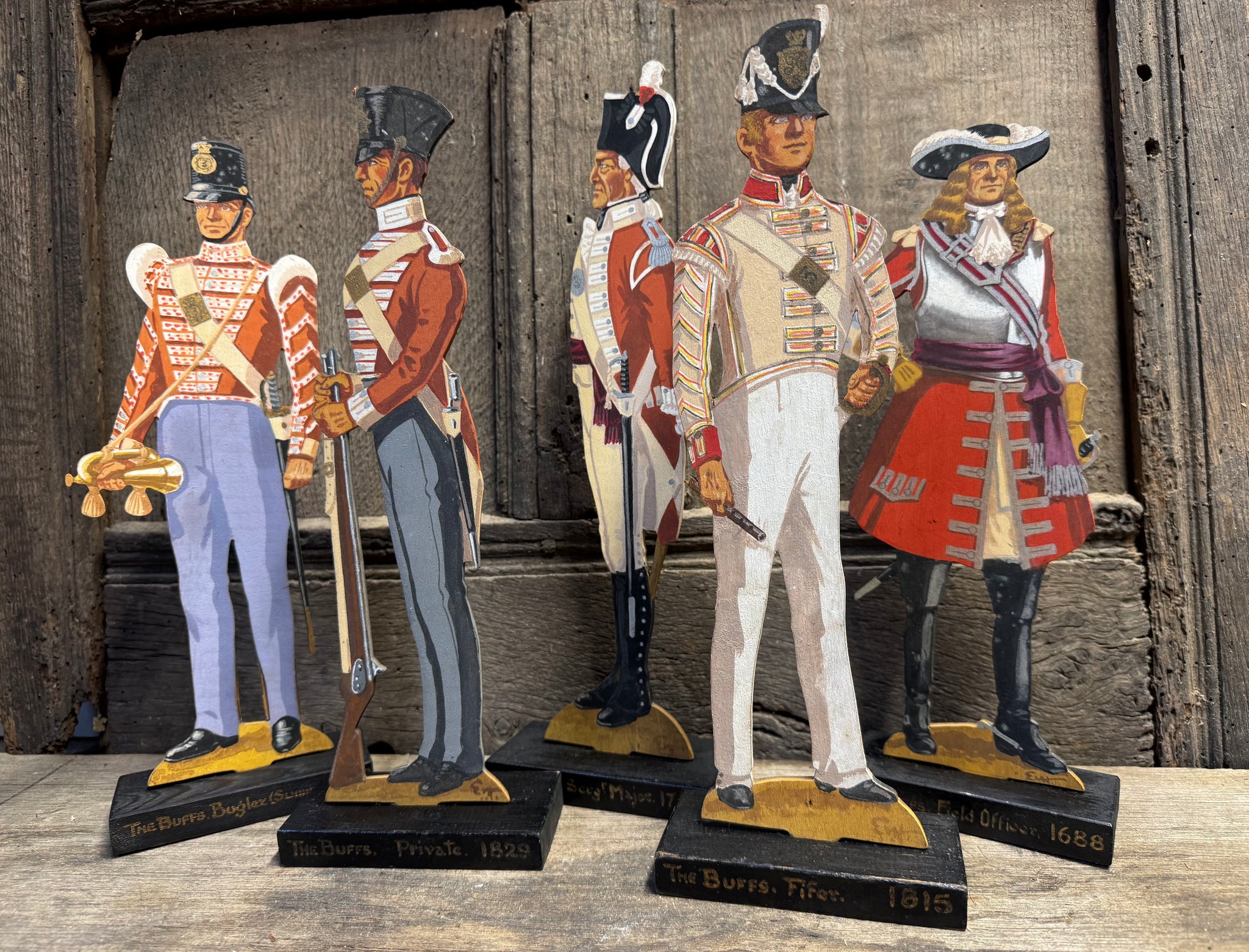 A  group of five  wooden painted soldiers The Buffs by Lt E.V Howell c. 1929