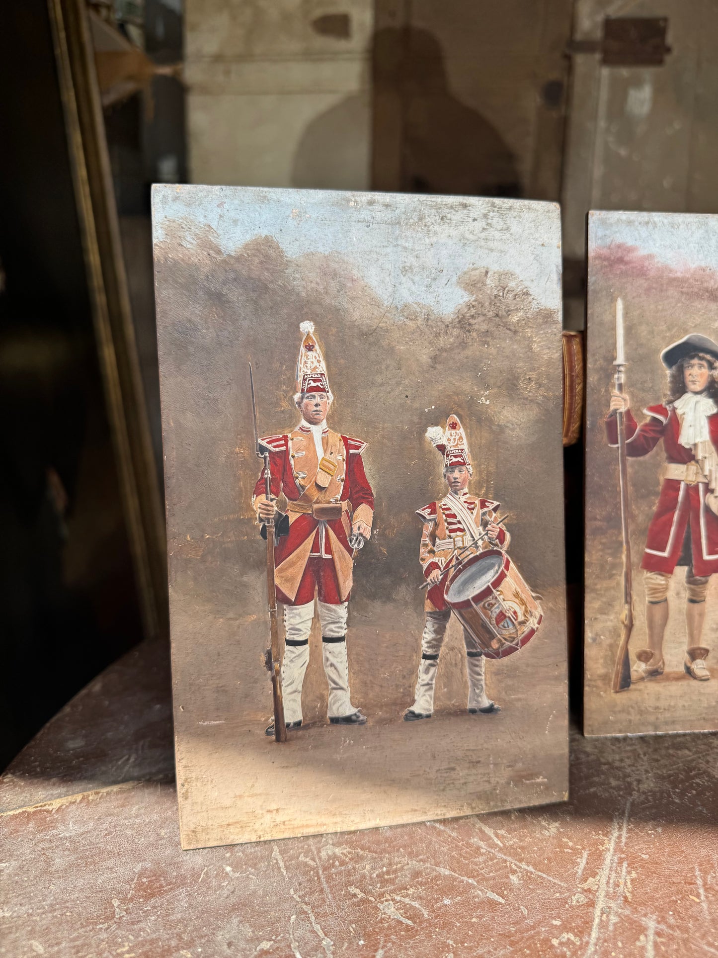 An unusual set of 4 early 20th century painted soldiers on panel
