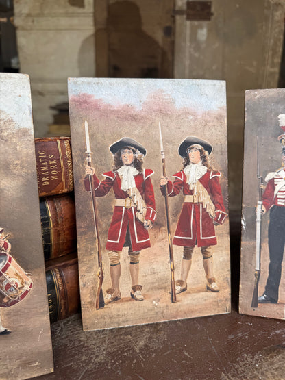 An unusual set of 4 early 20th century painted soldiers on panel