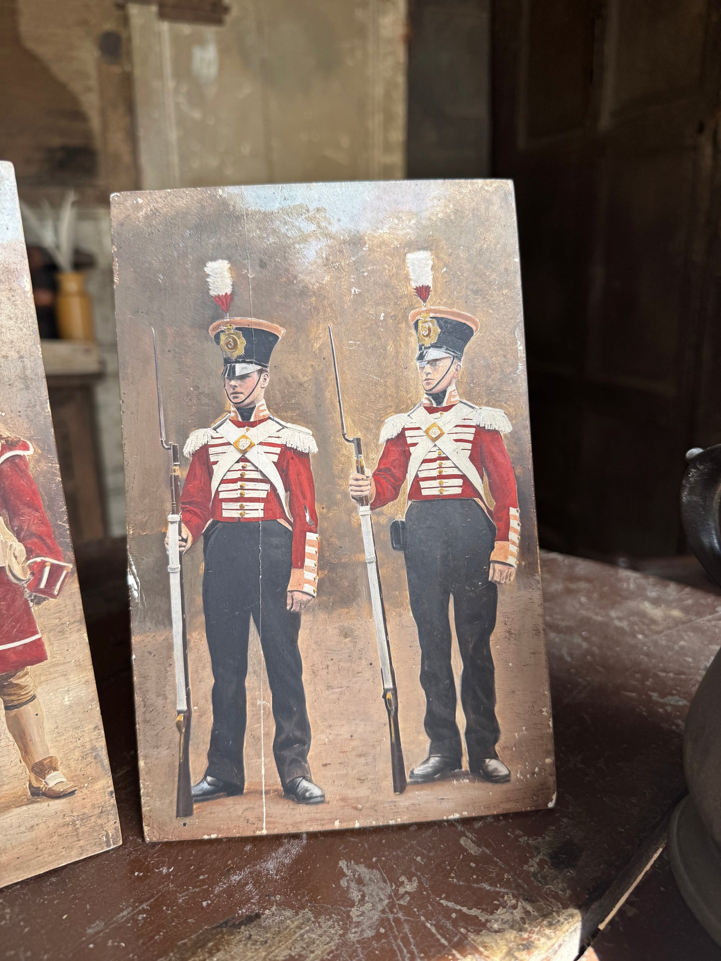 An unusual set of 4 early 20th century painted soldiers on panel