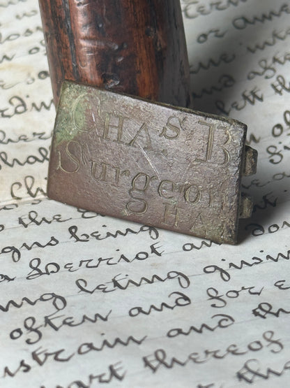 An unusual  George III brass clasp for "Chas B, Surgeon"