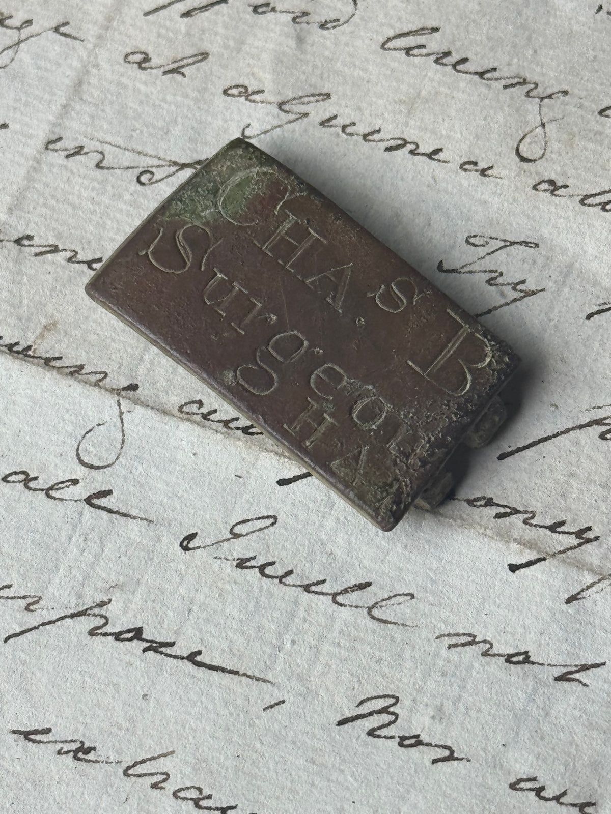 An unusual  George III brass clasp for "Chas B, Surgeon"