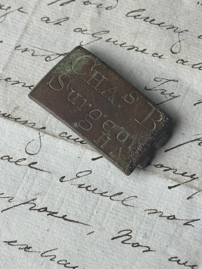 An unusual  George III brass clasp for "Chas B, Surgeon"