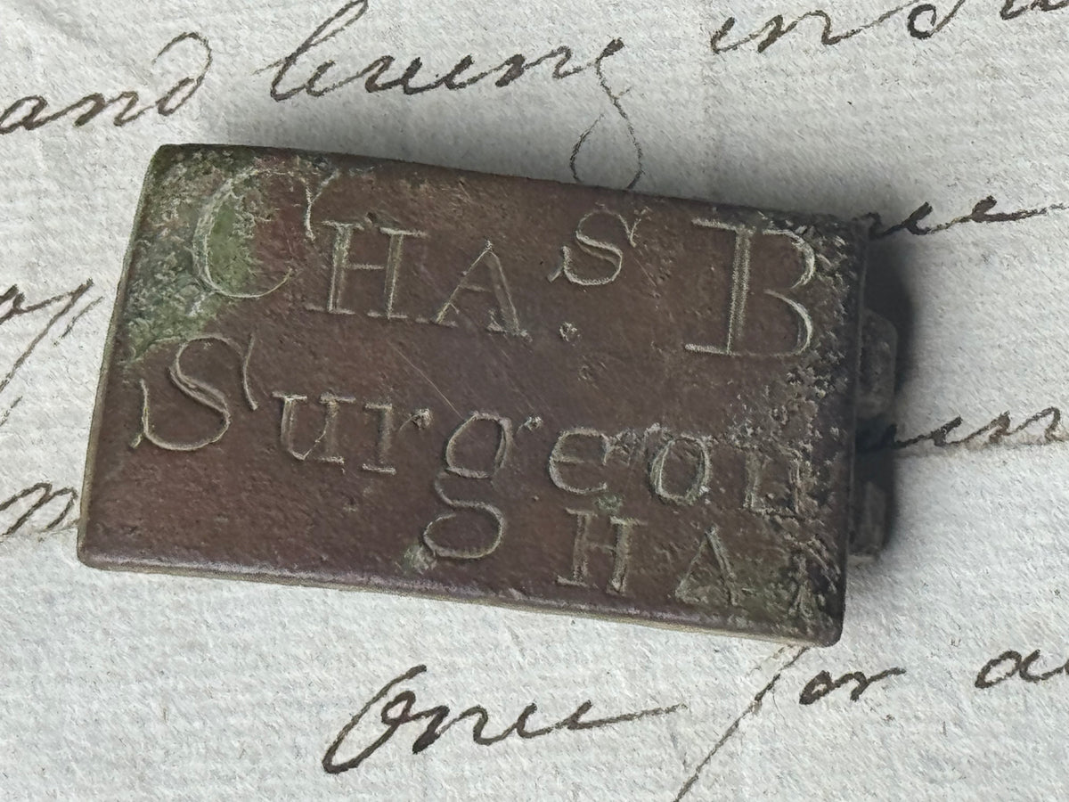 An unusual  George III brass clasp for "Chas B, Surgeon"
