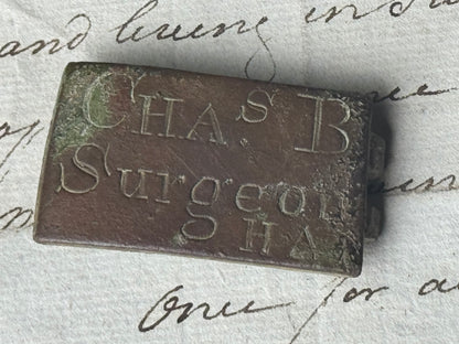 An unusual  George III brass clasp for "Chas B, Surgeon"