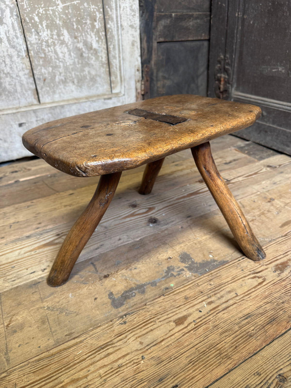 18th century vernacular oak stool with hedgerow splayed legs and blacksmith repairs c. 1790