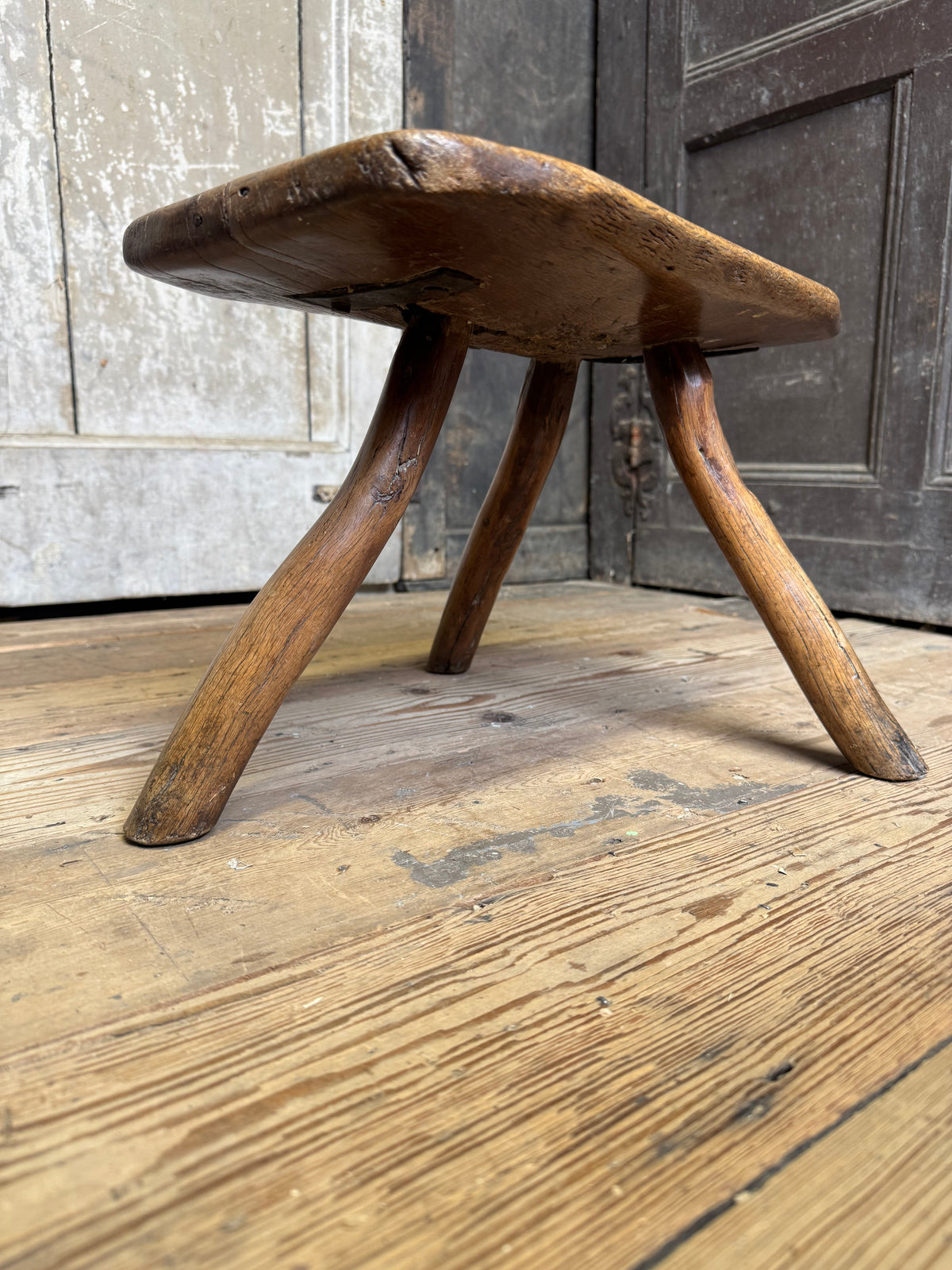 18th century vernacular oak stool with hedgerow splayed legs and blacksmith repairs c. 1790