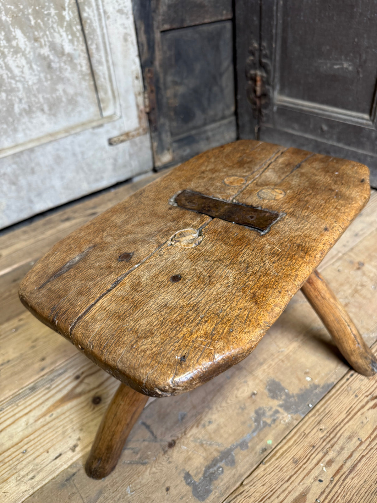 18th century vernacular oak stool with hedgerow splayed legs and blacksmith repairs c. 1790
