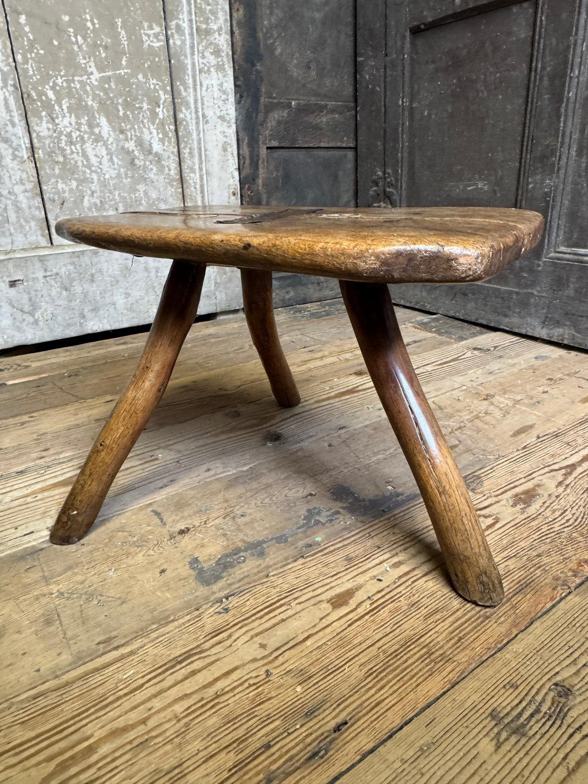 18th century vernacular oak stool with hedgerow splayed legs and blacksmith repairs c. 1790
