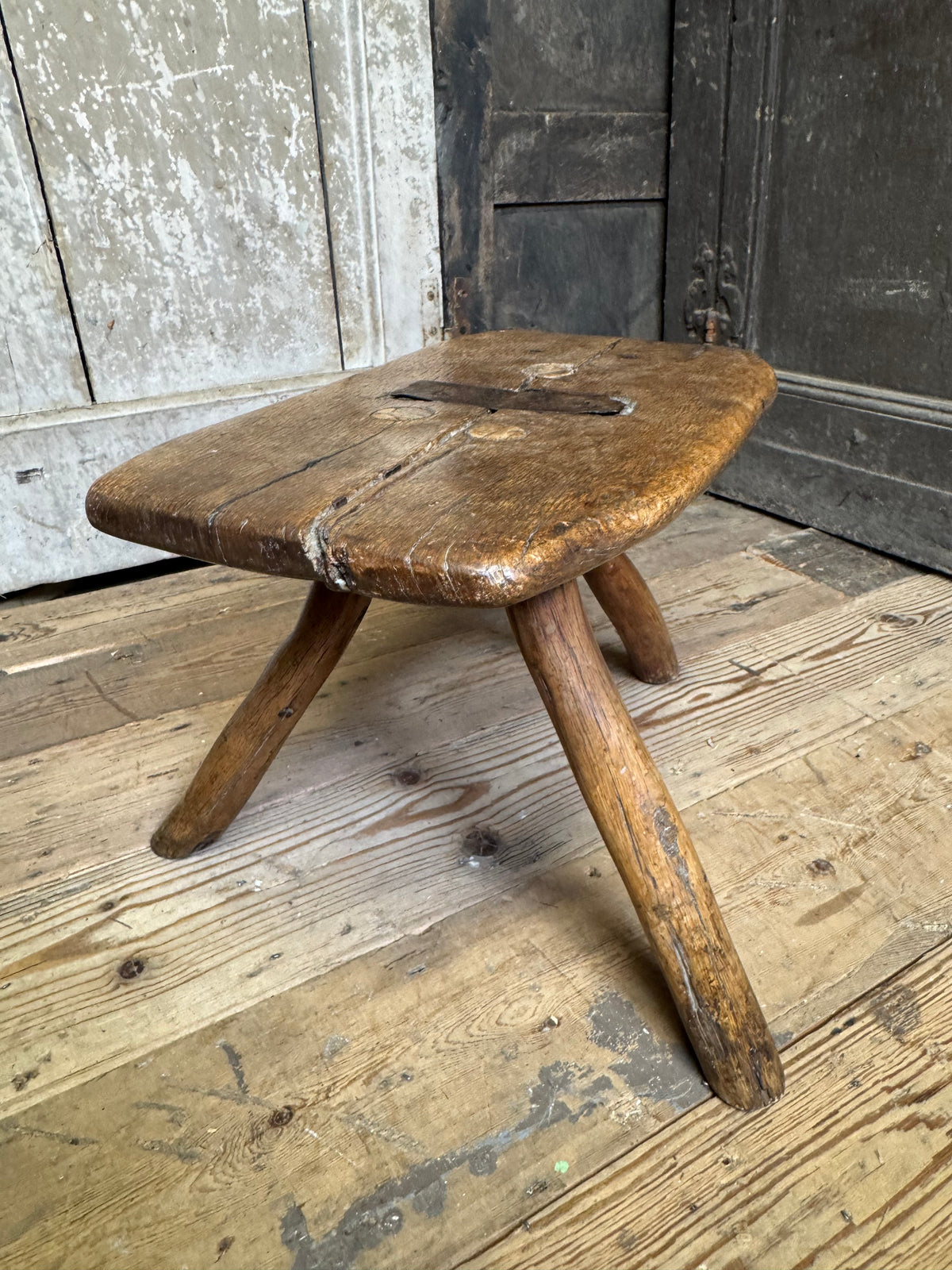 18th century vernacular oak stool with hedgerow splayed legs and blacksmith repairs c. 1790