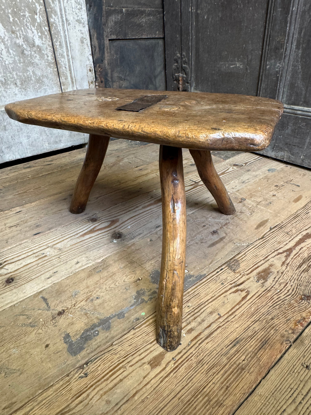 18th century vernacular oak stool with hedgerow splayed legs and blacksmith repairs c. 1790