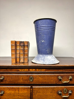 A large mid century tole florist vase in blue
