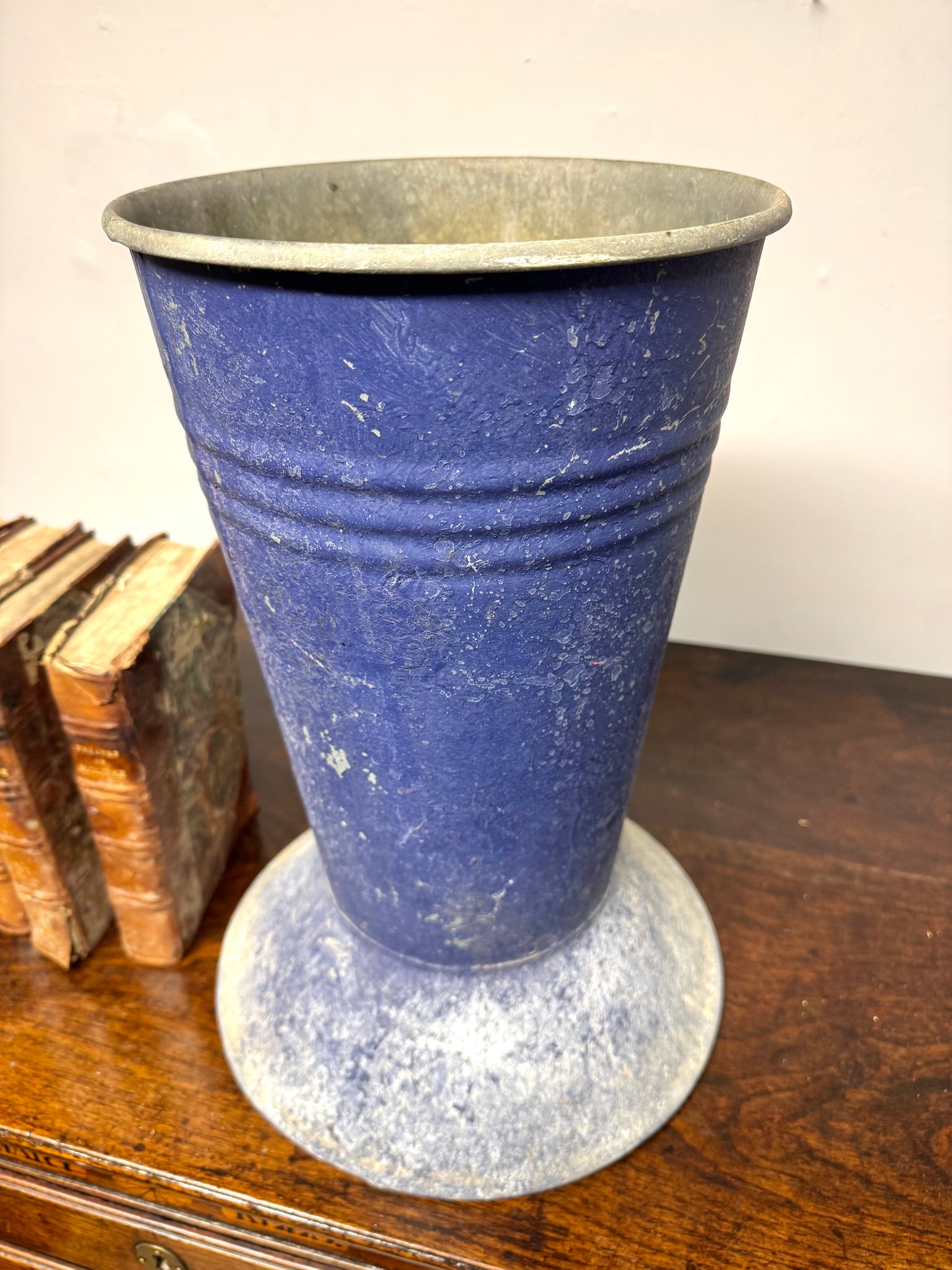 A large mid century tole florist vase in blue