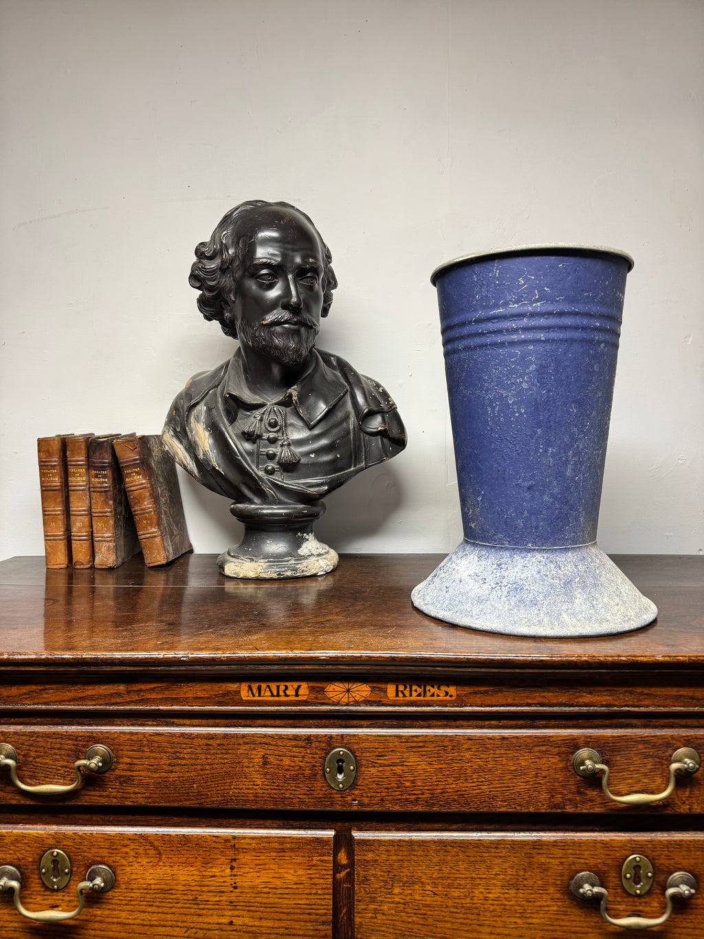 A large mid century tole florist vase in blue