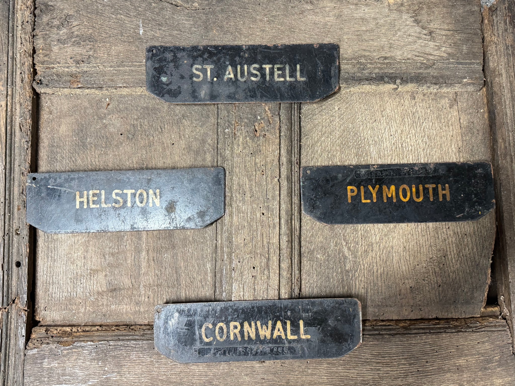 A set of four tole West Country Post office delivery location signs