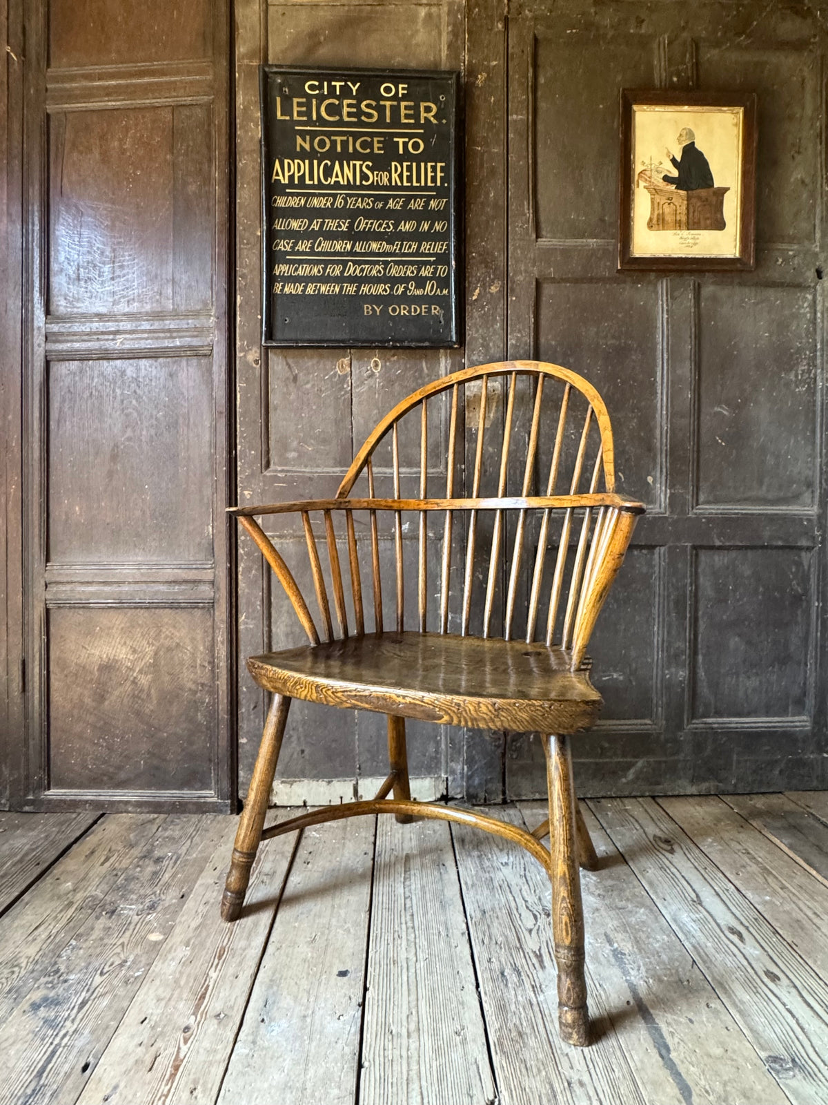 A George III West Country elm & ash Windsor armchair with crinoline  stretcher, c.1800–1820