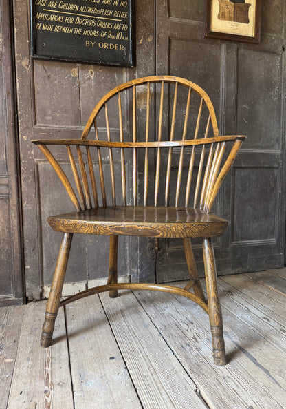 A George III West Country elm & ash Windsor armchair with crinoline  stretcher, c.1800–1820