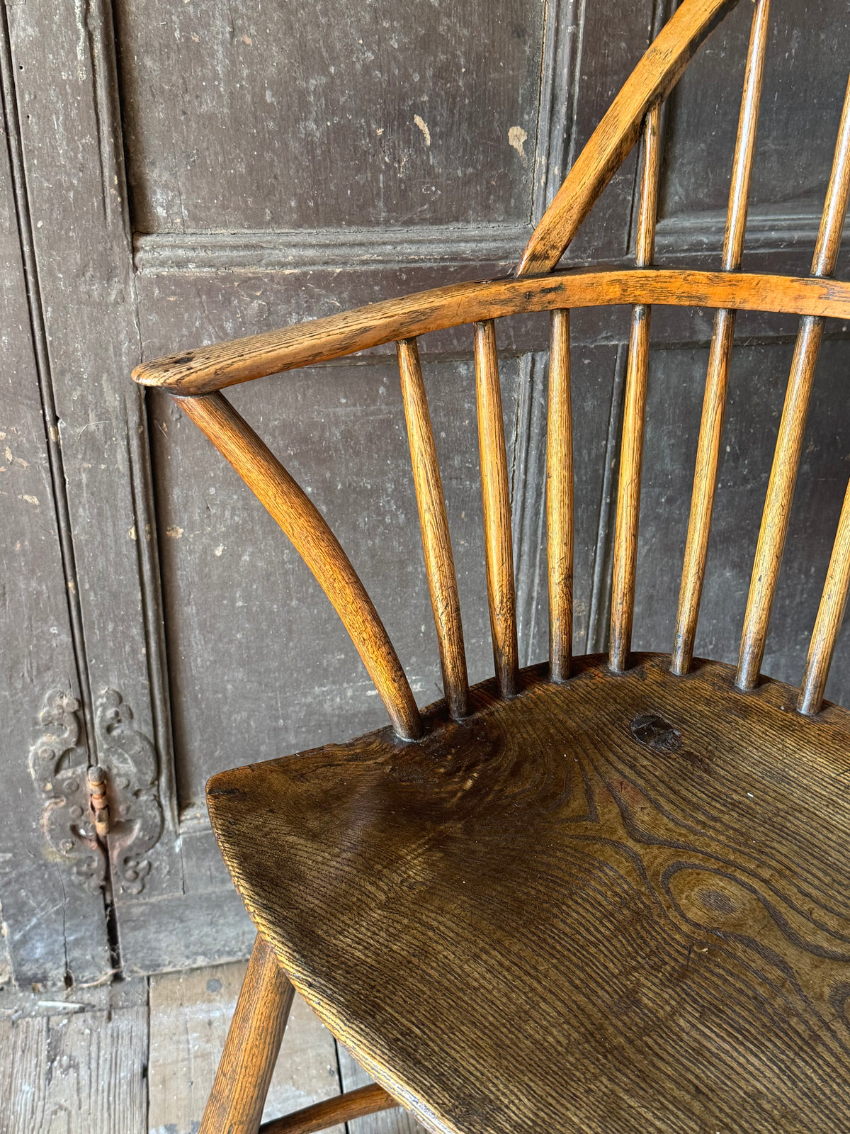 A George III West Country elm & ash Windsor armchair with crinoline  stretcher, c.1800–1820