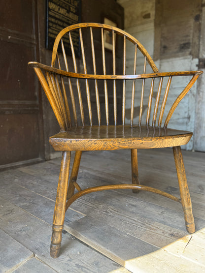 A George III West Country elm & ash Windsor armchair with crinoline  stretcher, c.1800–1820