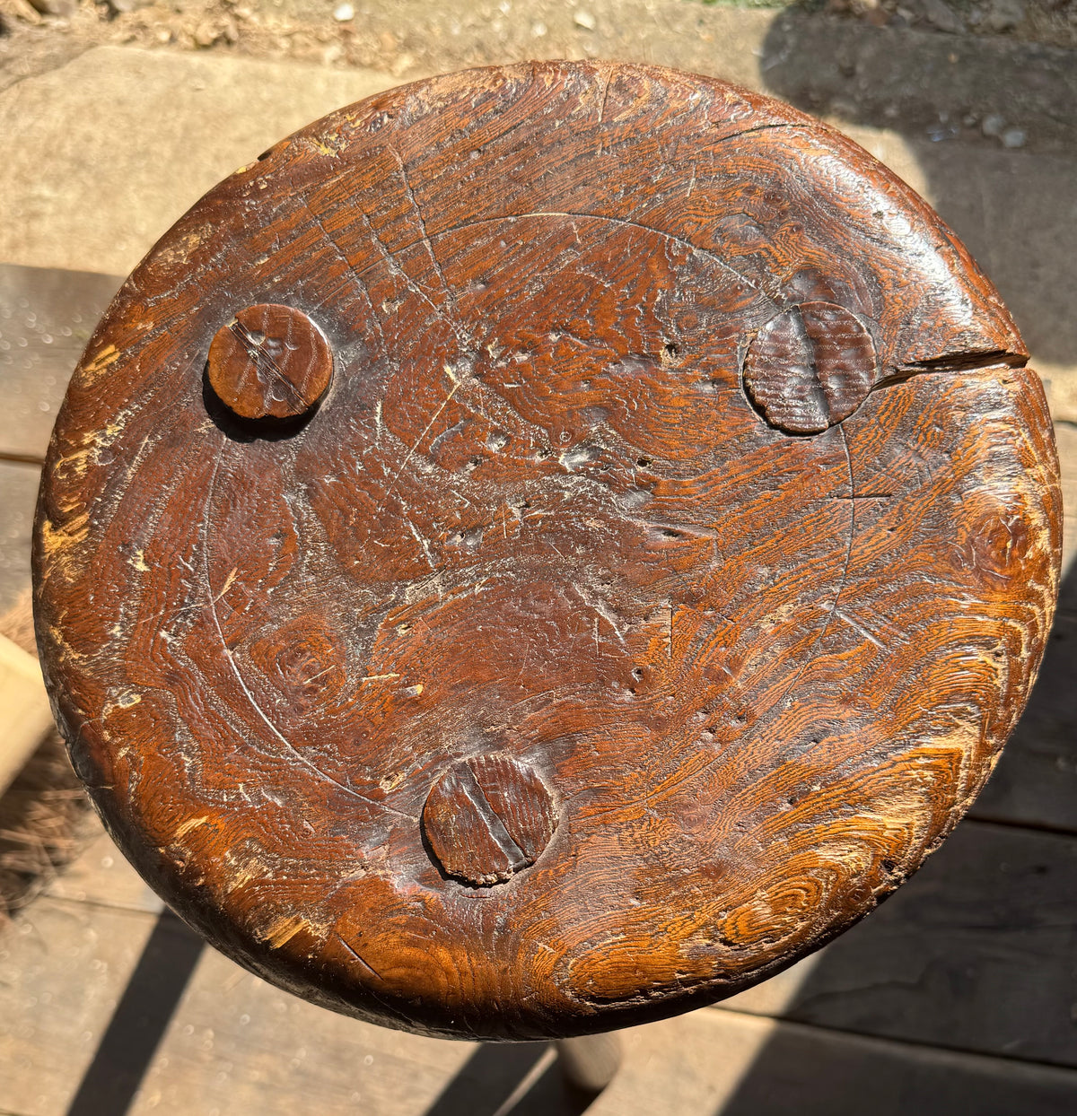 A good size 19th century elm top stool