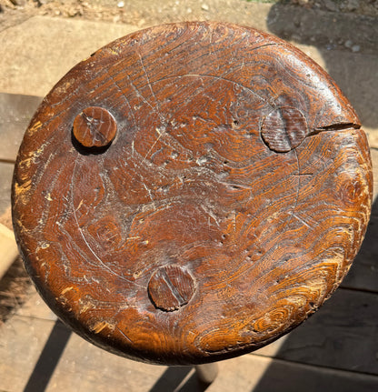 A good size 19th century elm top stool
