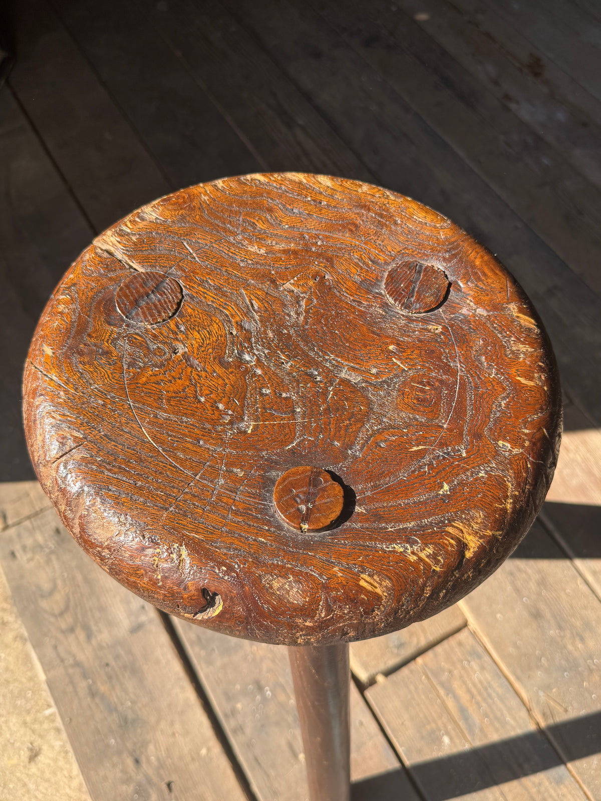 A good size 19th century elm top stool