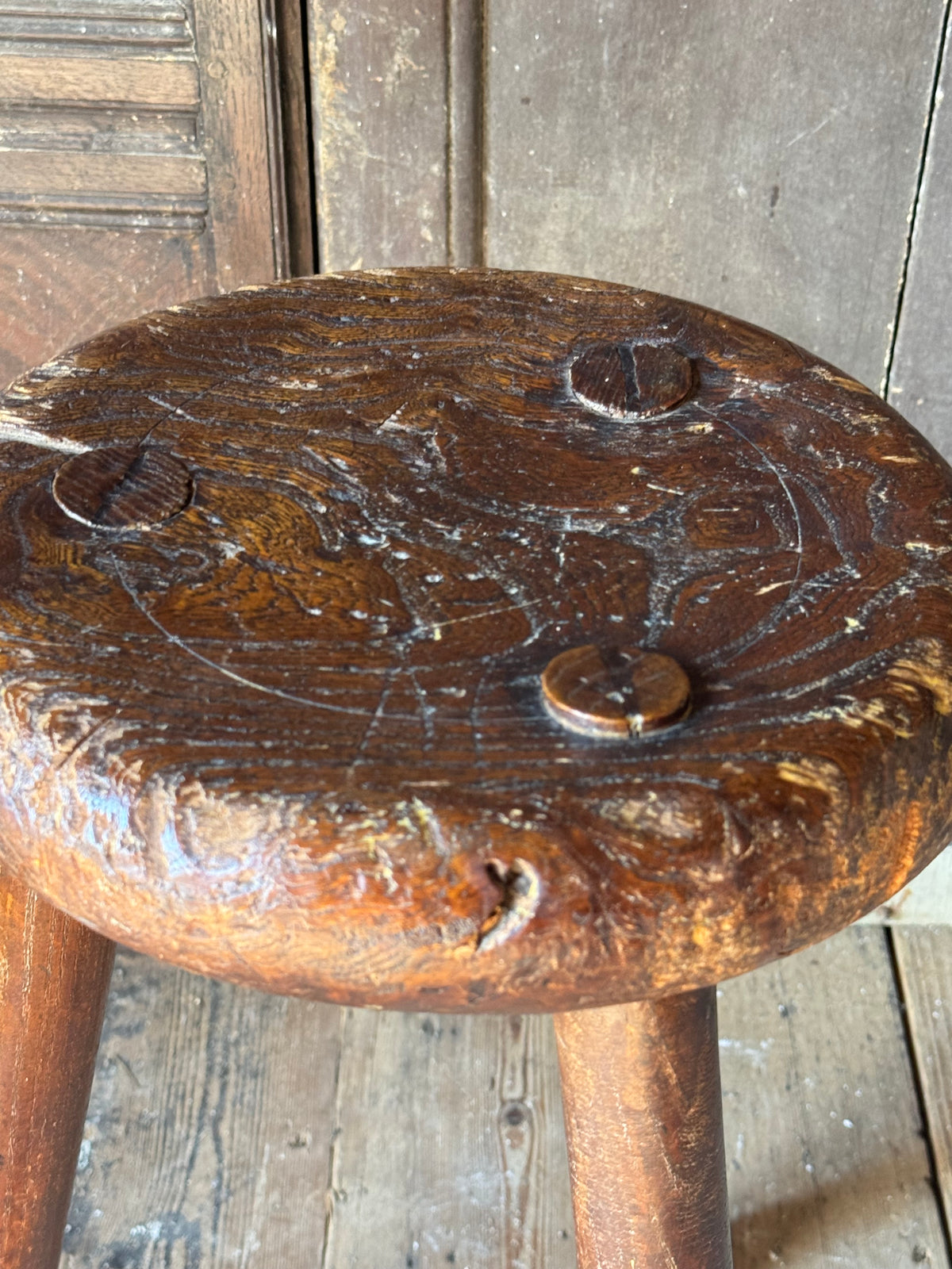 A good size 19th century elm top stool