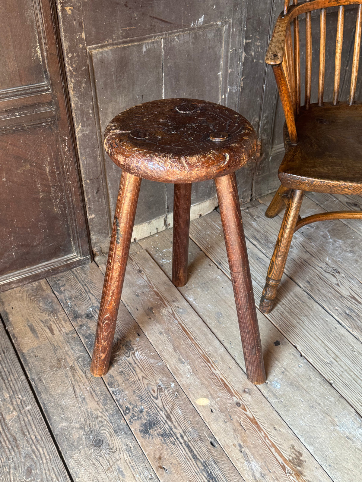 A good size 19th century elm top stool