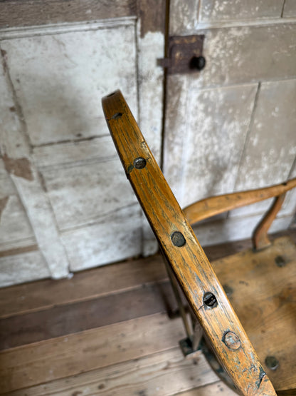 An unusual George III elm and ash high hoop-back Windsor armchair, probably West Country, circa 1800