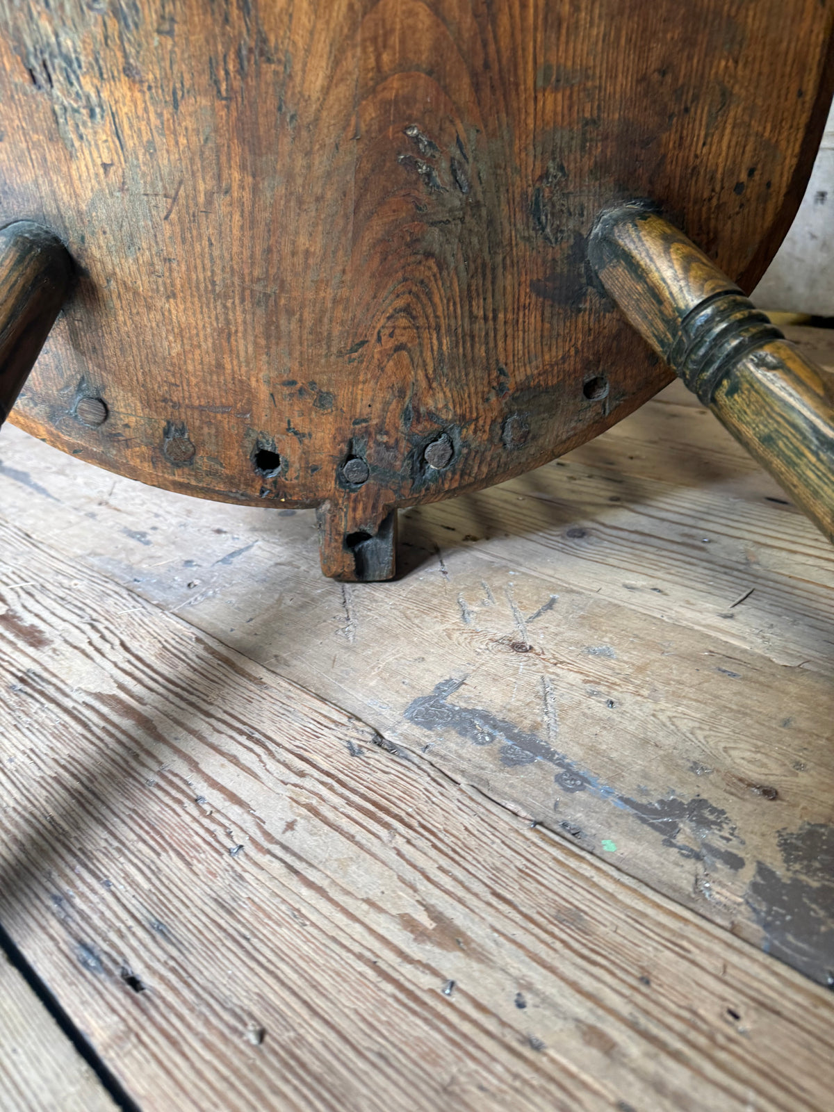 An unusual George III elm and ash high hoop-back Windsor armchair, probably West Country, circa 1800