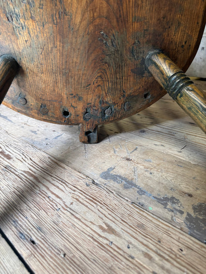 An unusual George III elm and ash high hoop-back Windsor armchair, probably West Country, circa 1800