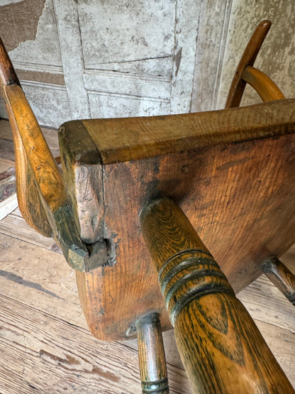 An unusual George III elm and ash high hoop-back Windsor armchair, probably West Country, circa 1800