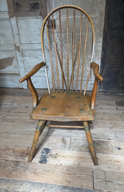 An unusual George III elm and ash high hoop-back Windsor armchair, probably West Country, circa 1800