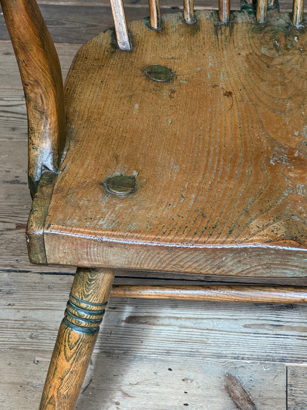 An unusual George III elm and ash high hoop-back Windsor armchair, probably West Country, circa 1800