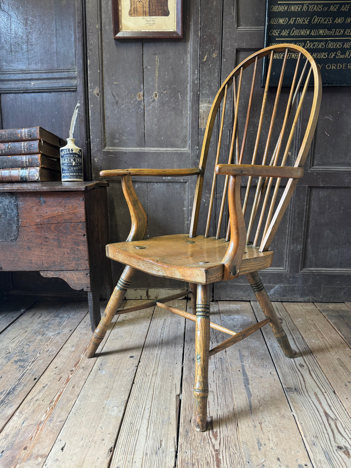 An unusual George III elm and ash high hoop-back Windsor armchair, probably West Country, circa 1800