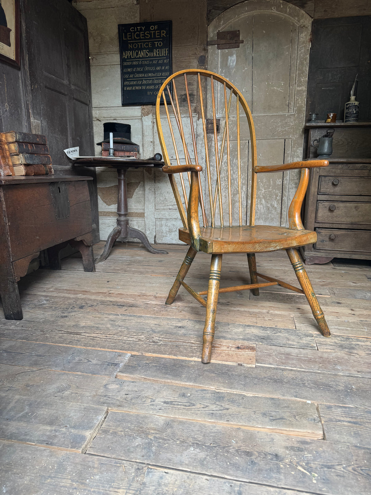 An unusual George III elm and ash high hoop-back Windsor armchair, probably West Country, circa 1800