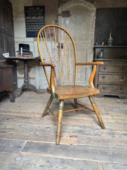 An unusual George III elm and ash high hoop-back Windsor armchair, probably West Country, circa 1800