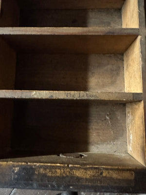 A 19th century set of mahogany apothecary wall shelves with original labels to drawer interiors