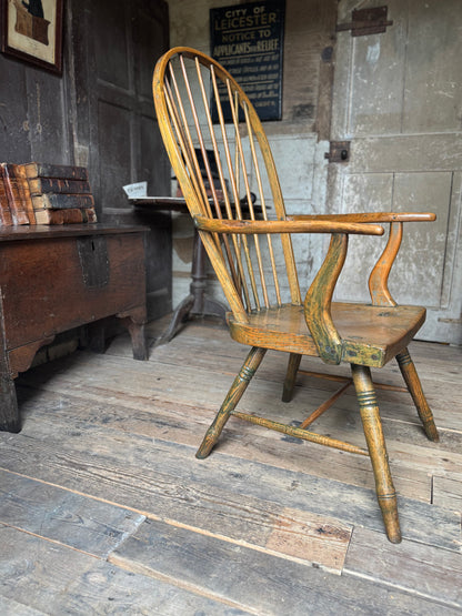 An unusual George III elm and ash high hoop-back Windsor armchair, probably West Country, circa 1800