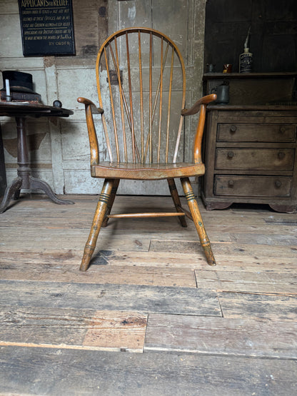 An unusual George III elm and ash high hoop-back Windsor armchair, probably West Country, circa 1800