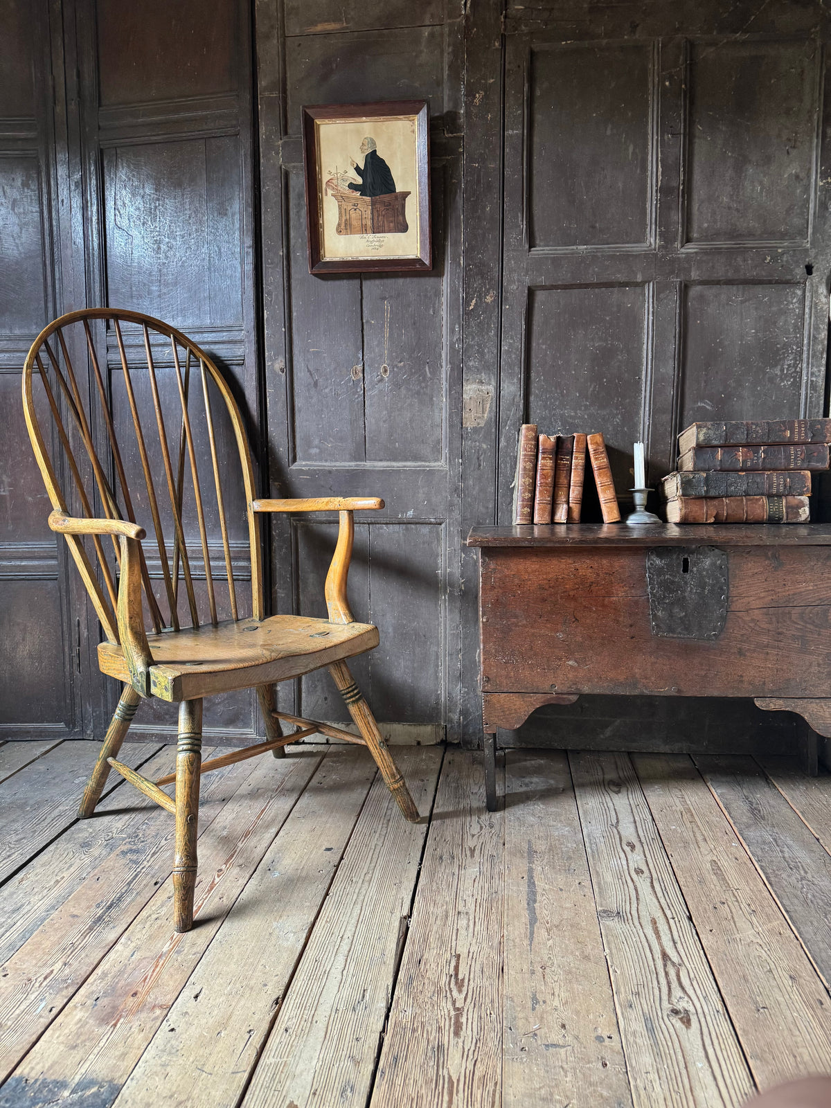 An unusual George III elm and ash high hoop-back Windsor armchair, probably West Country, circa 1800