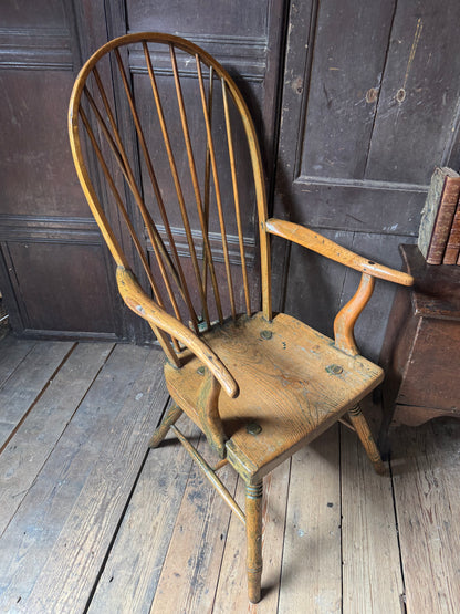 An unusual George III elm and ash high hoop-back Windsor armchair, probably West Country, circa 1800