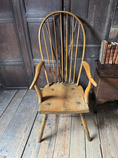An unusual George III elm and ash high hoop-back Windsor armchair, probably West Country, circa 1800